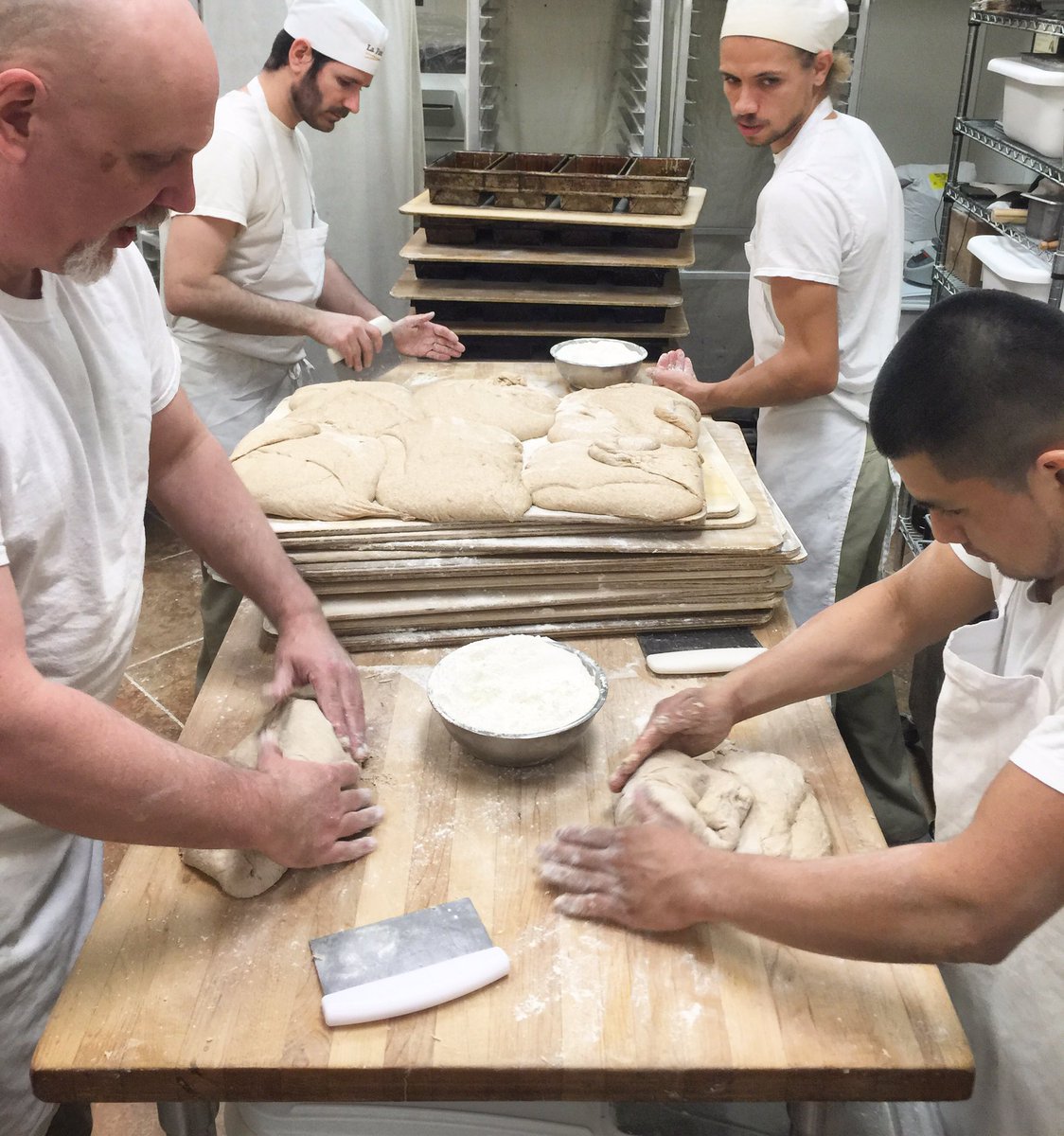gardenandgun's tweet photo. RT @lafarmcary: Many #skilledhands shaping breads for our bakery... And to take to @chswineandfood today! #chswff https://t.co/5Brkikd4Zi