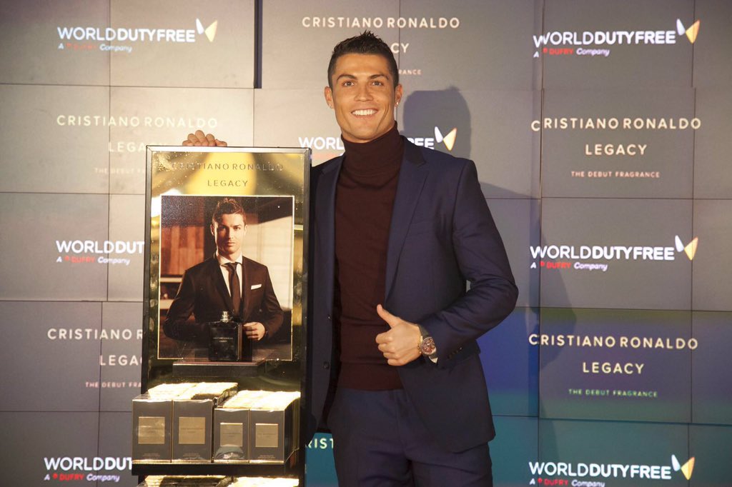 Cristiano's tweet photo. Here with friends from #WorldDutyFreeES, celebrating my new fragrance #CristianoRonaldoLegacy at Madrid airport! https://t.co/D1SVxYcab7