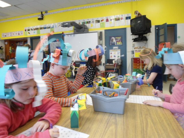 Wearing 100 Day hats to work on a 100 Day activity in kindergarten. <a href="/HaroldPell/">Taylor ES Principal</a> #ztroar #APS100Days