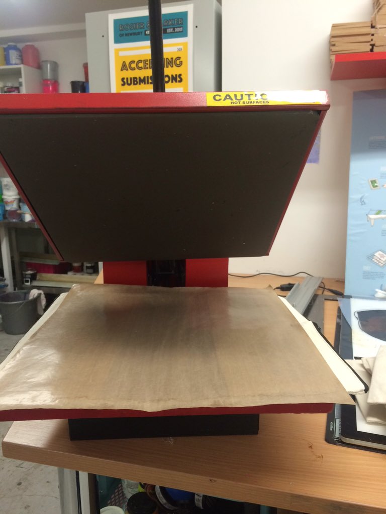 Heat pressing, cutting stickers and tweeting at the same time like an octopus