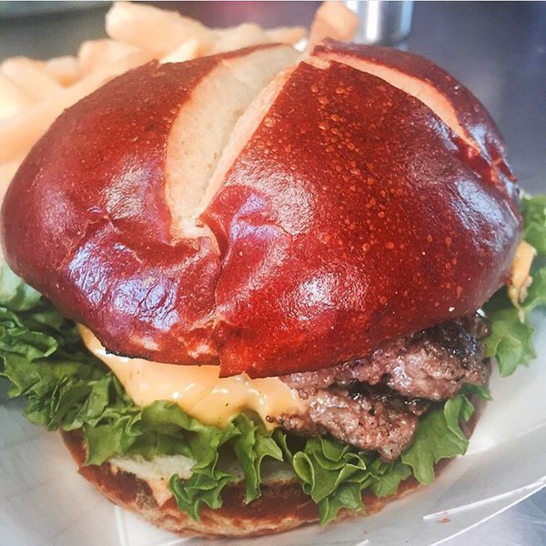 #FridayFeeling hungry because of this creation by @BURGERSGONEWILD. #burgers #pretzelbun #foodporrn