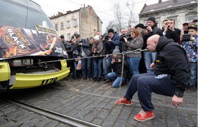 InstavibesMega's tweet image. See Amazing Photos of Ukrainian Doctor Pulling Five Tramcars With His Teeth... goo.gl/H2mExh