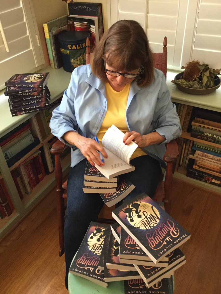 “Running Out of Night” is now out in paperback! Signing these to donate to schools with small budgets. Happy day!