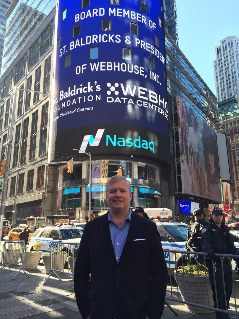 WebHouseHQ's tweet photo. President @BHoganNYC in front of the Nasdaq board after bell ringing. Good times for a great charity @StBaldricks https://t.co/vCJO5EBBGy