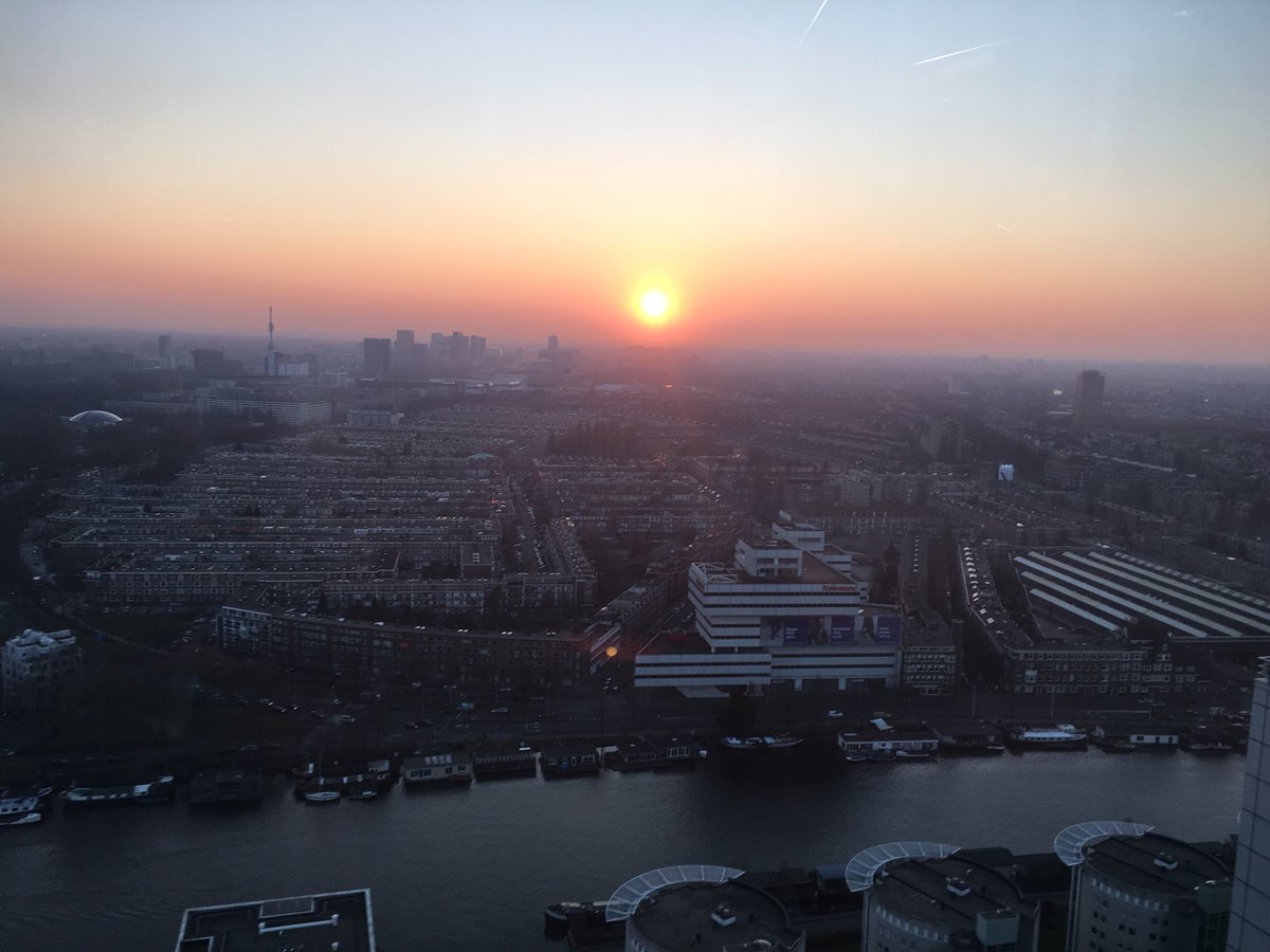 Clickly_co's tweet image. Yesterday a event @DeltaLloyd with this fantastic view over Amsterdam, enjoying this rare sunset. We love this city.