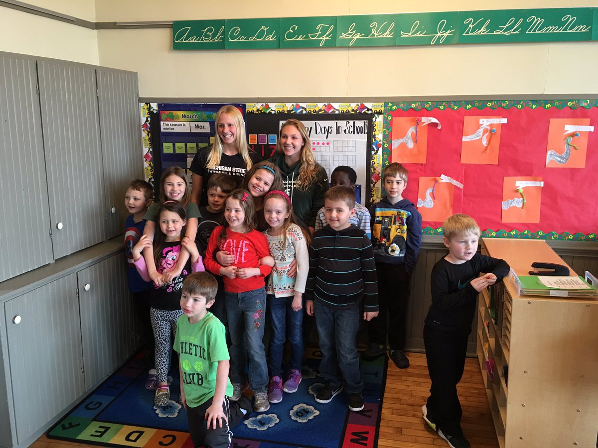 MSU_SASS's tweet photo. A day full of laughs &amp; smiles at Strange Elementary w/ Marina &amp; Emily (@MSUswimdive 🏊)  #MarchIsReadingMonth 📚📚 https://t.co/fhQlKJKXRc