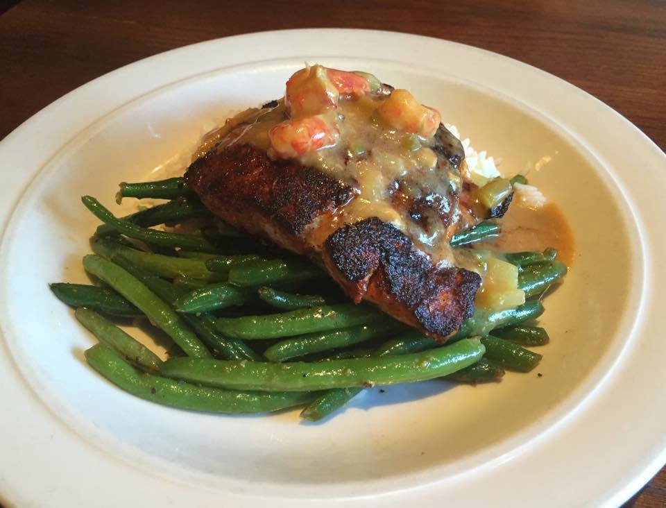 Crawfish on top of redfish? Mind blown. All this month with our Cajun green beans #OnTheChalkboard