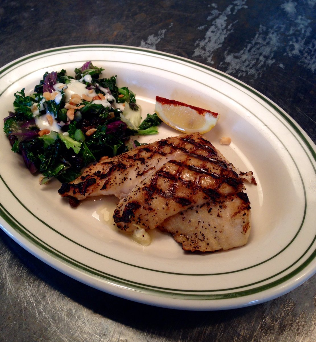 Wood grilled Snapper, kale sauté, garlic, raisin, yogurt, macadamia nut #lkhh #libertykitchen #houheights #snapper
