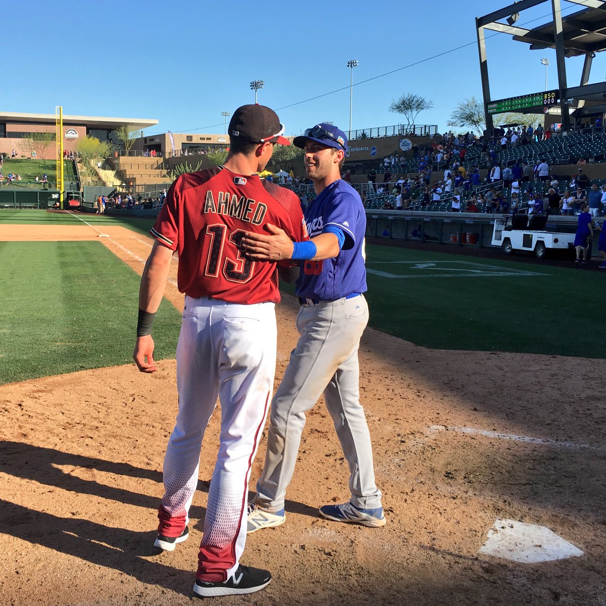 Dbacks's tweet photo. .@NickAhmed_ and his brother Michael catch up after today's #DbacksSpring game. https://t.co/S2hc6bPDYK