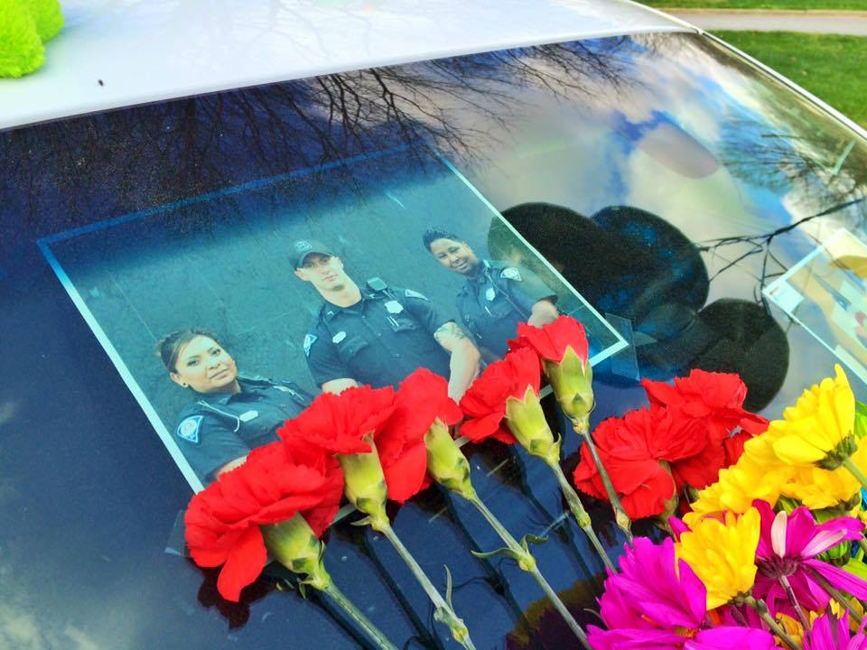 Many are remembering the life of fallen Greenville officer Allen Jacobs. Firefighters prayed at his patrol car.