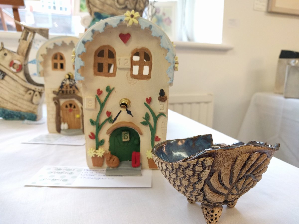 Cuckoo clock and pottery by Caroline Garfield, our new guest artist this month.
