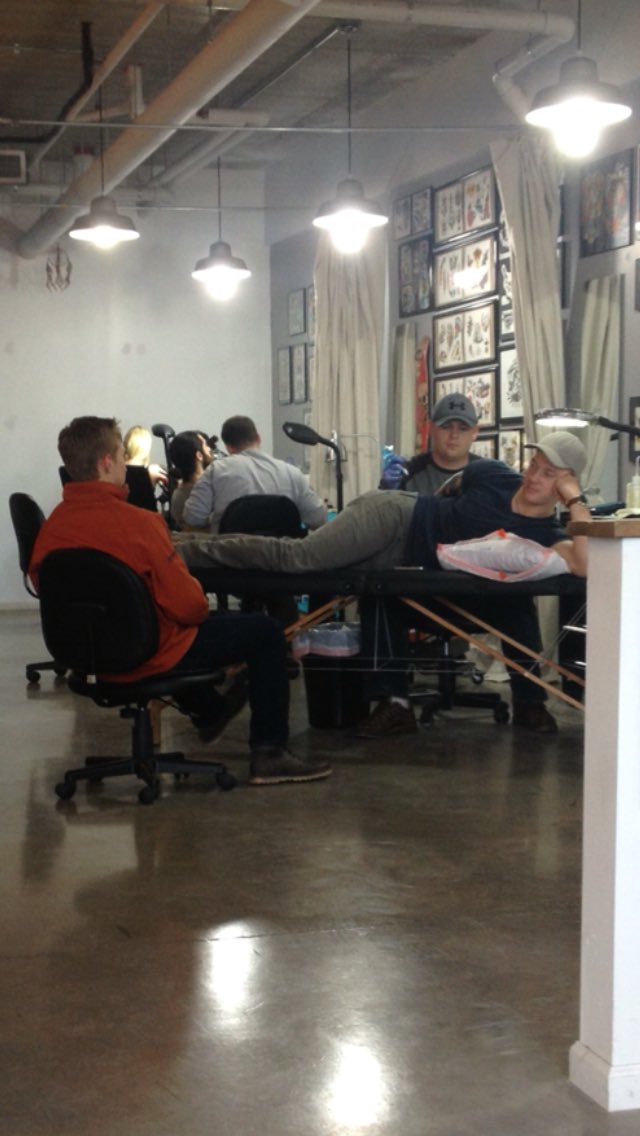 Kyler_K25's tweet photo. Getting a tattoo while @Grant3Hanson paints me like one of his French girls. https://t.co/hz8VFK0U7I