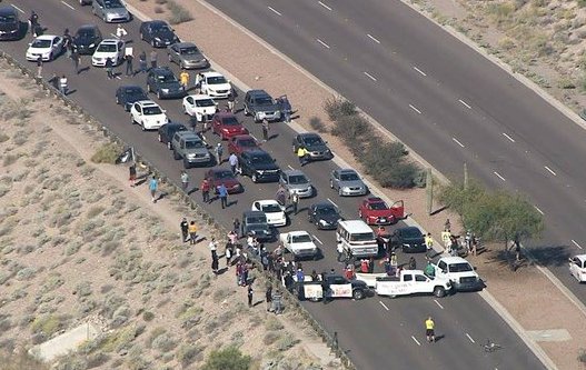 Irony: Trump protestors trying to stop a Trump rally… by building a wall.