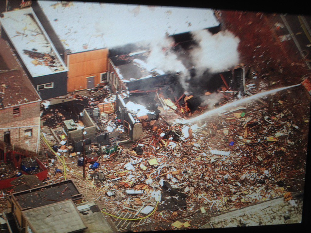 kiro7chopper's tweet photo. Firefighters STILL putting water on post explosion fire in Greenwood. Debris everywhere, streets closed for blocks. https://t.co/PcY40C1pgR