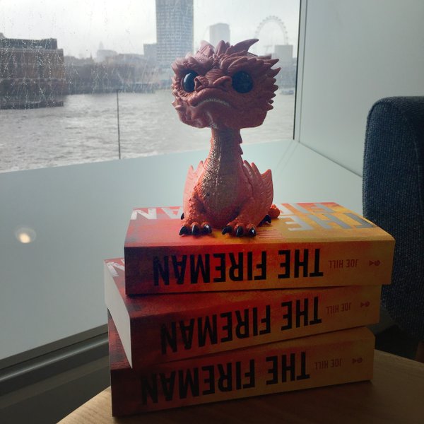 Our new desk mate has a hoard to guard! (Also win <a href="/joe_hill/">Joe Hill</a>'s #TheFireman on <a href="/goodreads/">Goodreads</a>) bit.ly/1QBfTbt