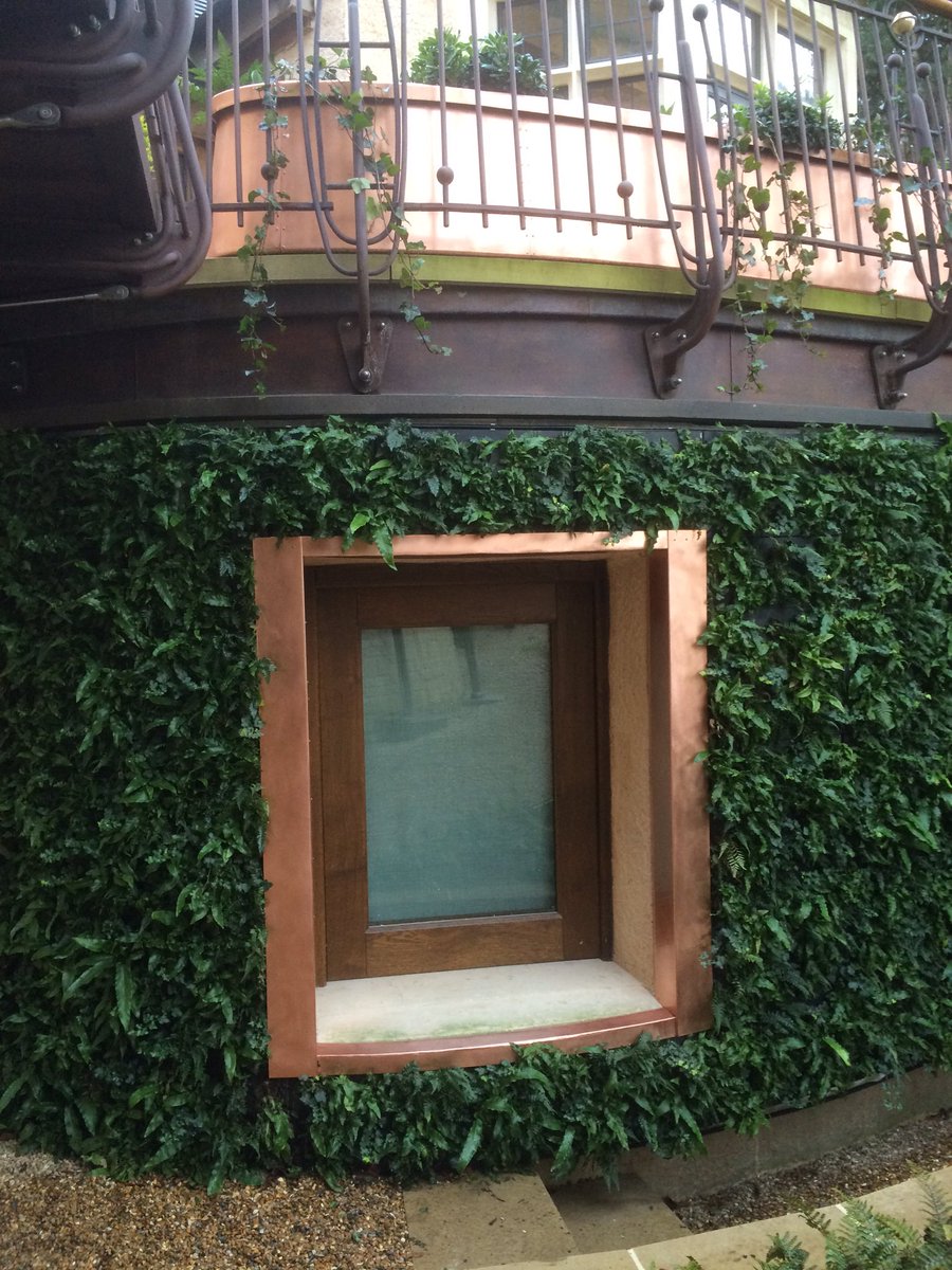 HotmetalToby's tweet photo. Dodging showers in W19 to fit copper trim to green wall @AnnMariePowell https://t.co/6NiylM74ku