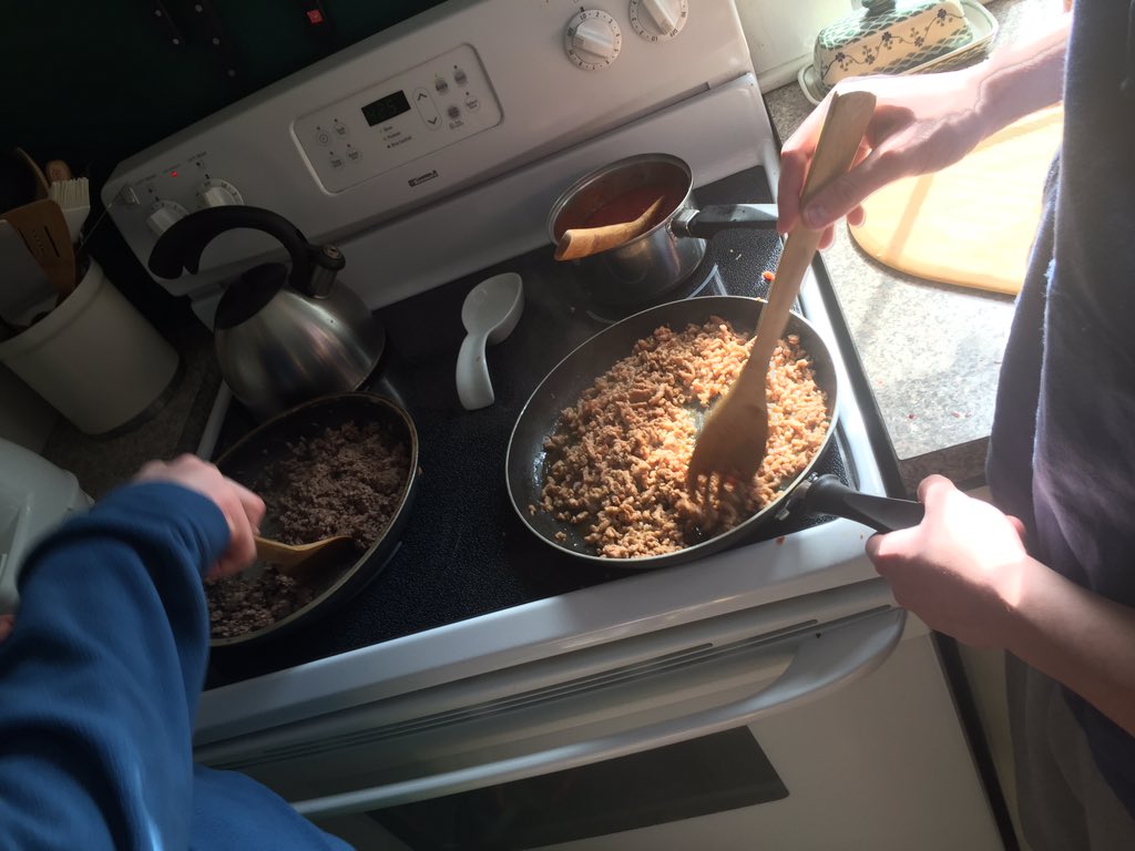 NHSCooking's tweet image. Boys cooking meat for the pizza