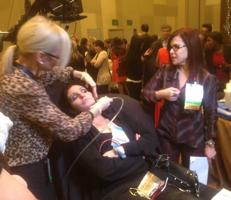 lauralmcdermott's tweet image. #TBT giving Dr. Jeannette Graf a @DermaSweep while Dr. Vivian Bucay was speaking! #CSF #CSF2013 #DermaSweep