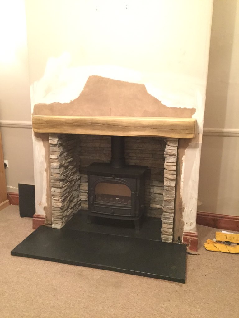 Slate hearth stacked stone chamber concrete beam  stove <a href="/dantonfires/">Danton Fireplaces</a>