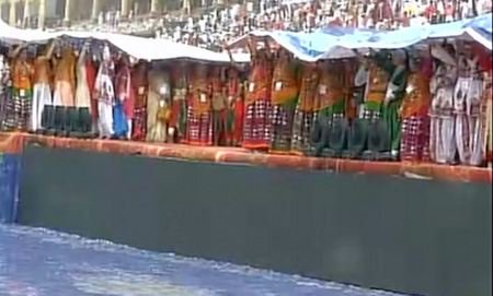 timesofindia's tweet photo. Heavy rains force participants to take shelter at the venue of #WorldCultureFestival in Delhi: ANI (Photo: ANI) https://t.co/QtejTC3jyi