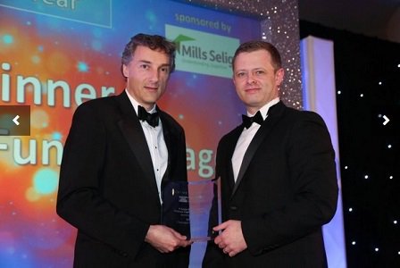 Brian Cummings receiving Private Equity House/Venture Capitalist of the Year Award from Chris Guy, Mills Selig.