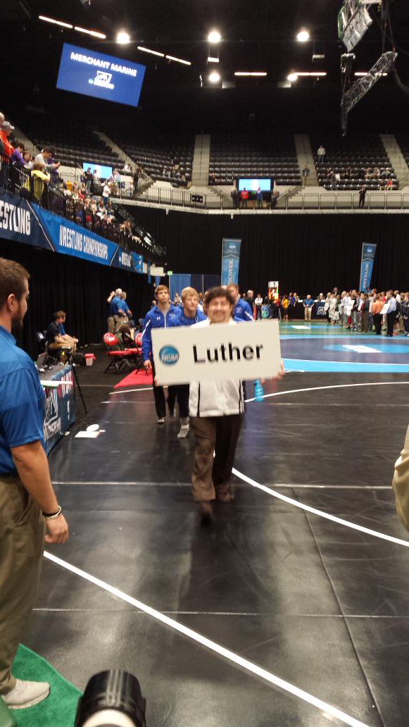 LutherWrestling's tweet photo. Coach Billy leading the team out for opening ceremonies #tlan https://t.co/6L9NLC9fbd