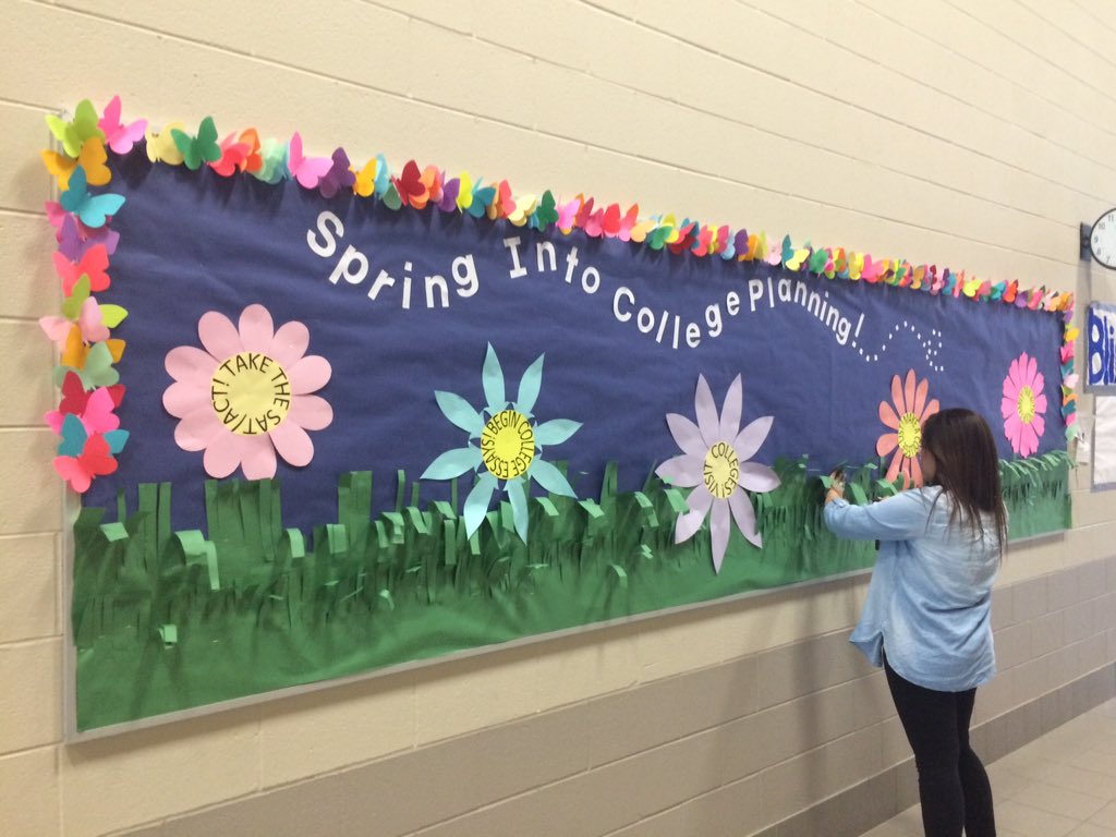 My student assistant is working on the latest college bulletin board! 🌸🌻🌷🐝#SpringIntoCollegePlanning