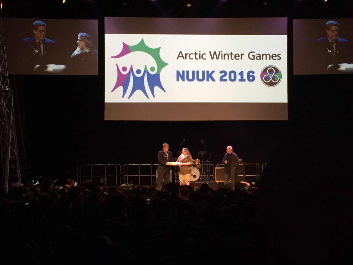AWG2018's tweet photo. Mayor Brad Mapes and Mayor Lynn Napier-Buckley accepting the AWG flag #AWG2018 #bringingthegameshome https://t.co/QMYjA48E0Y