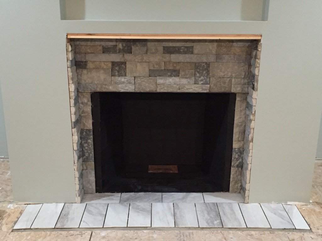 CraftyEsquire's tweet photo. Almost done with this weekend's #DIY #fireplace renovation. A little more tile and stone and we're ready for trim! https://t.co/EuLwpmOqOc