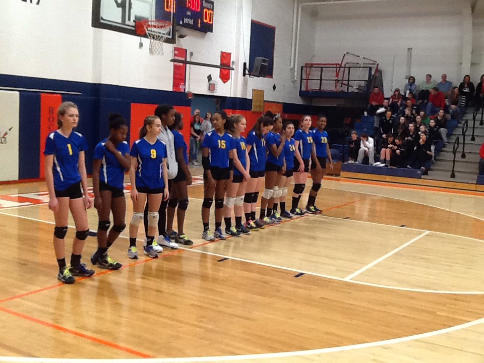 Parker 8th grade girl's volleyball teams waits for the quarterfinal match of the IESA State Tournament to begin.
