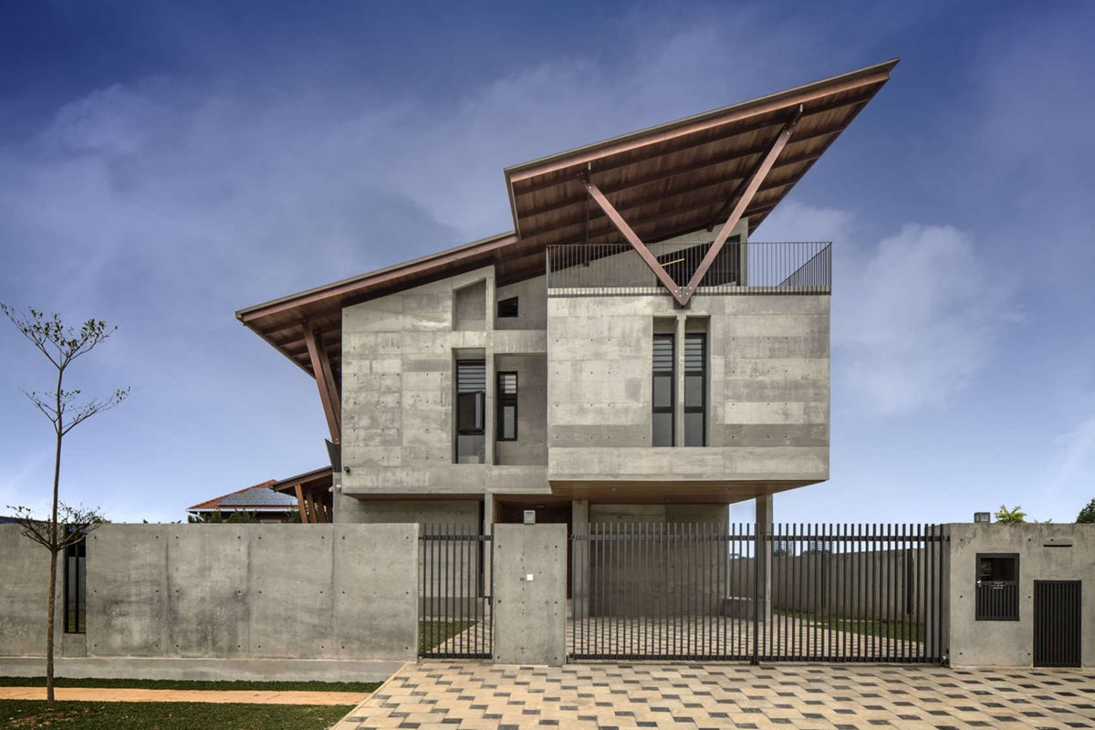 A house in Malaysia is made entirely from timber, concrete and brick. Tour the interior: arc.ht/1XmMIuf