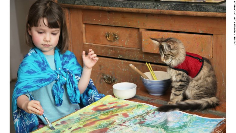 CNNThisMorning's tweet photo. Portrait of a 6-year-old artist with autism and her therapy cat: https://t.co/nBAyc2DgSy https://t.co/kUv6UzPo2i
