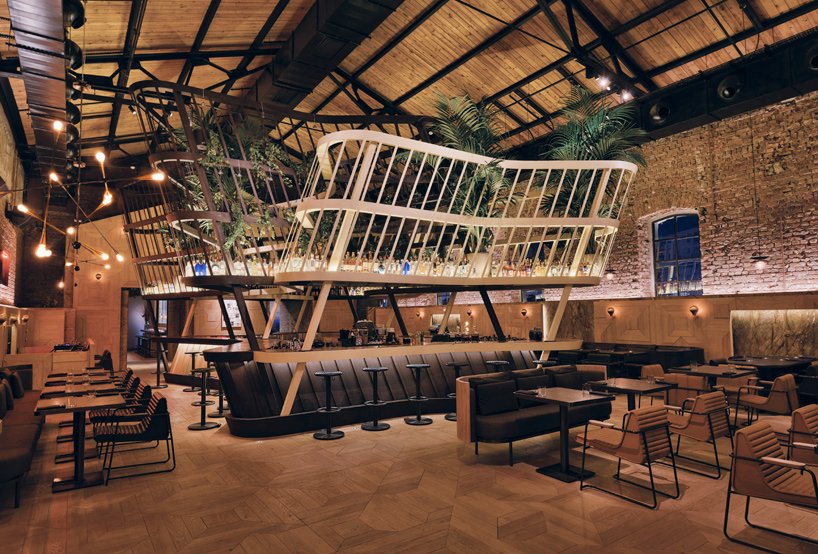 designboom's tweet photo. autoban sets kilimanjaro restaurant within warehouse in istanbul https://t.co/cKm9a1MxFq https://t.co/EpdkOAsTny