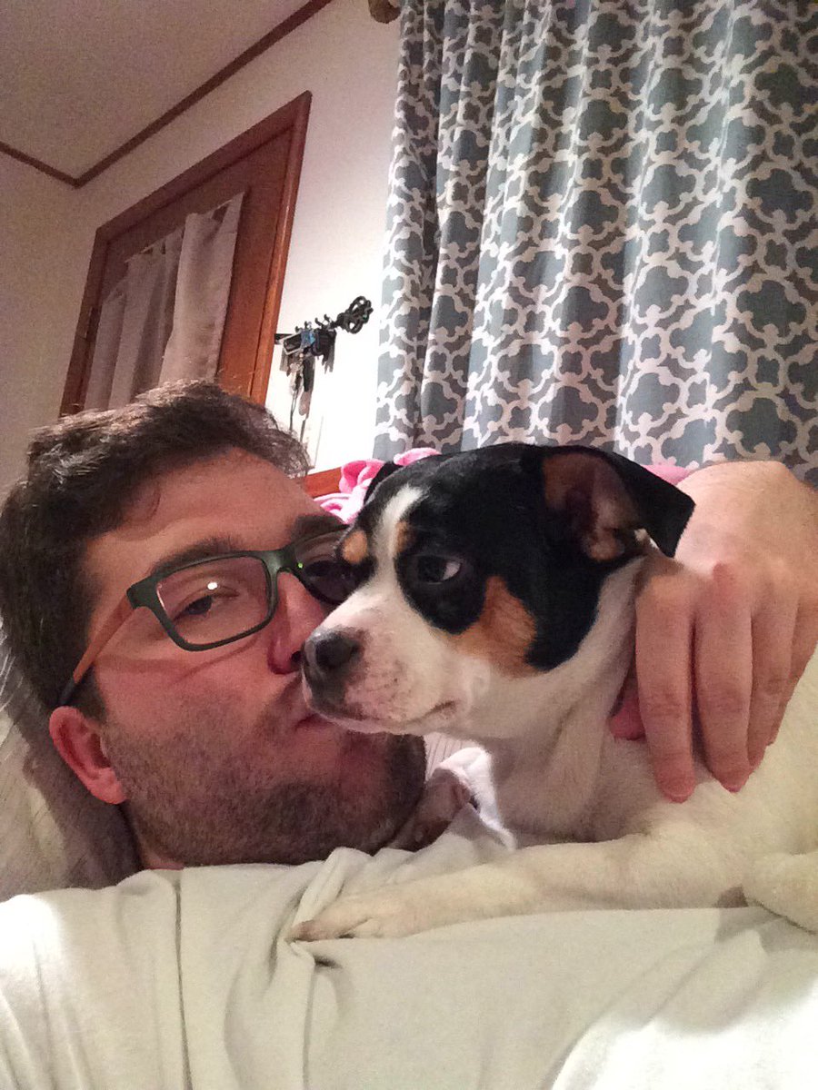 James_Tierney's tweet photo. I can't tell if Penny likes cheek kisses or not. #ThingsWhitePeopleLike #KissingDogs https://t.co/BfoR88I1MK