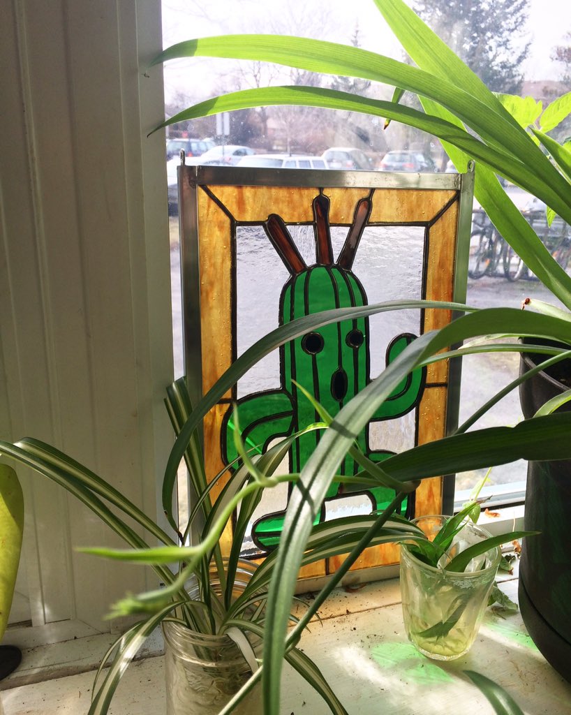 Gorefang42's tweet photo. Cactuar is a perfect fit for my plant filled window. #finalfantasy #customstainedglass https://t.co/CjjwawpmPq