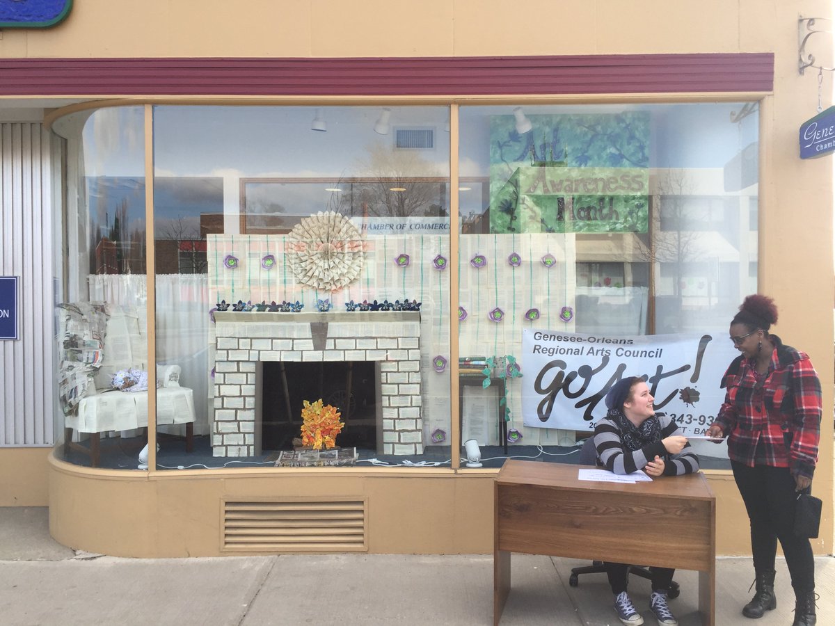 GOGOART's tweet photo. Our intern's office location last week.  She is in front of the Genesee Chamber of Commerce window. #GOGOART https://t.co/f3yg2XzDzo