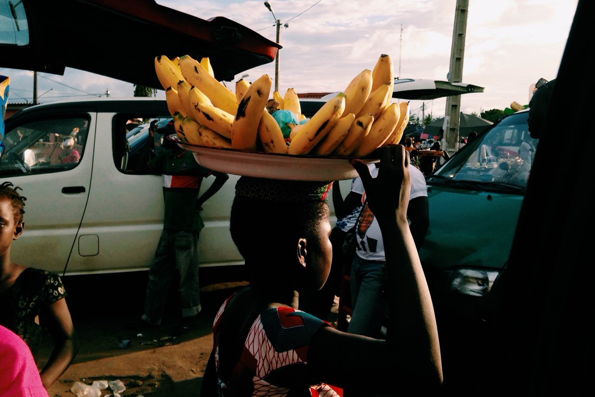 A few weeks ago in Grand Bassam, a young girl selling bananas at the bus stop.  #attaquebassam