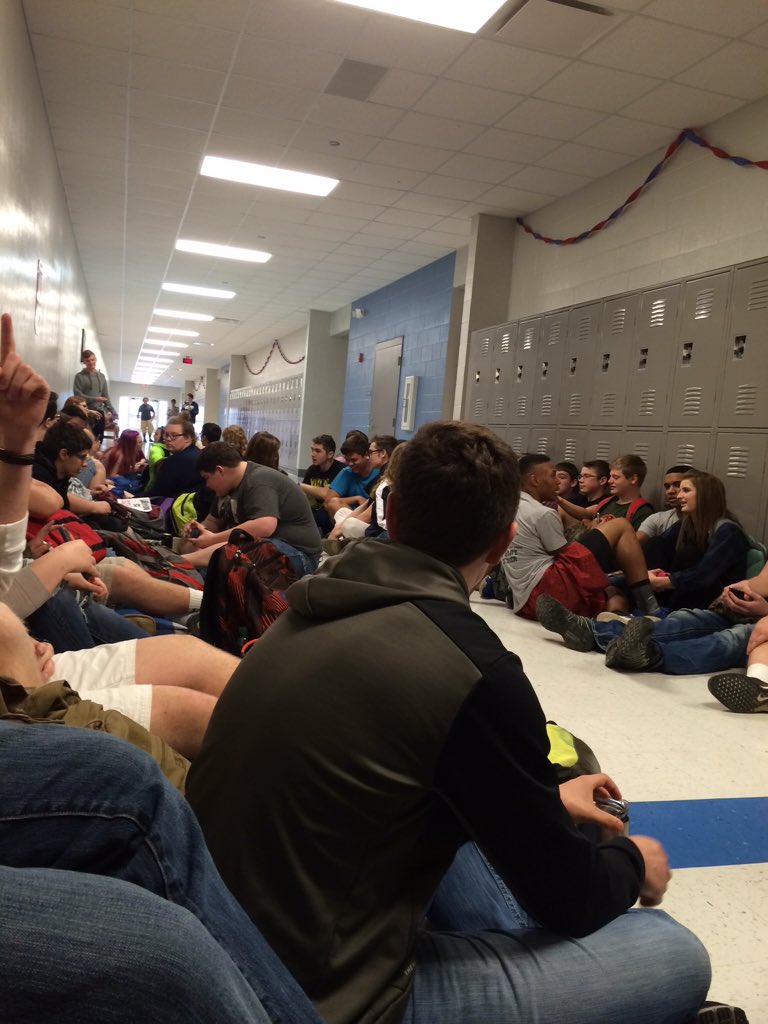 FreeJonBarber's tweet photo. Students of CHS protesting the School Board's decision to fire Mr. Barber with a sit-in in the history hallway. https://t.co/abpzHrD0Ia