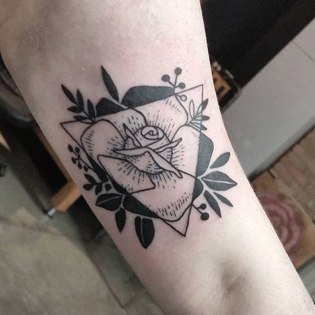 Negative space flower on the forearm  Tattoogridnet