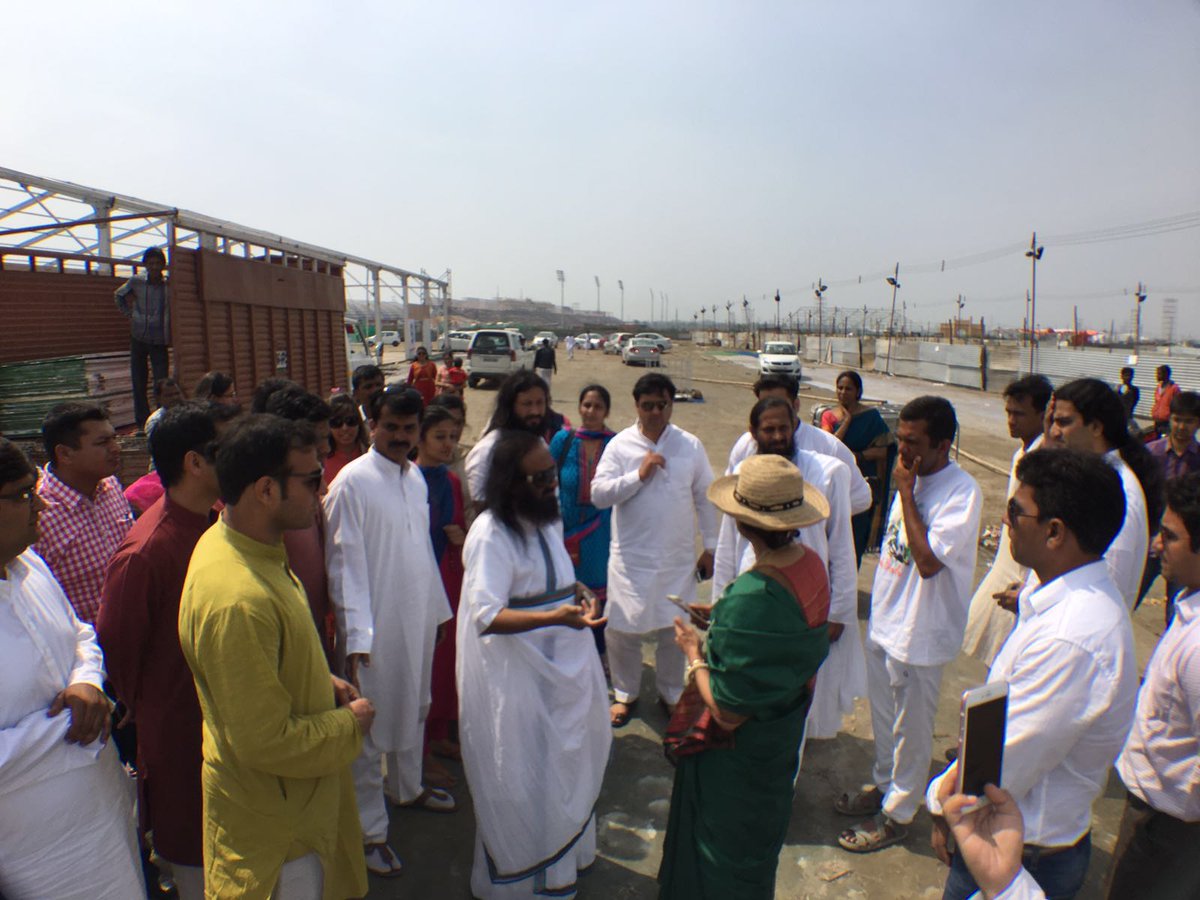 OfficeOfGurudev's tweet photo. Gurudev @SriSri at the @WCF2016 venue this afternoon inspecting the garbage cleaning activity https://t.co/cu9lT9jKdb