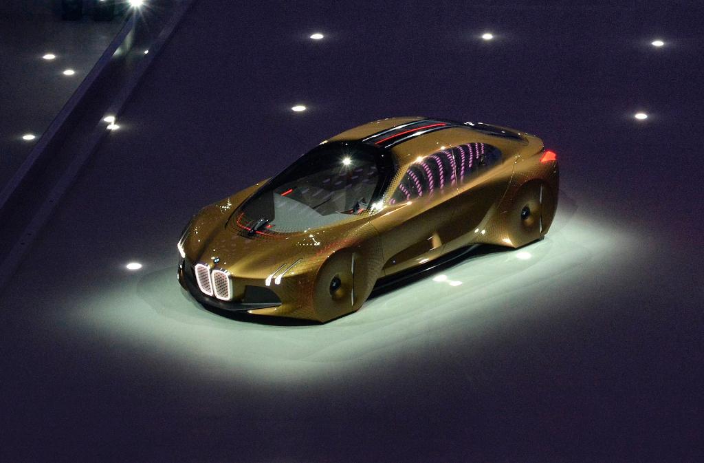 BMW's tweet photo. Glowing on stage and boasting ideas for the future: the #BMW VISION #next100. https://t.co/uzzrZ3wy2y https://t.co/ZlrJ0tTnjU