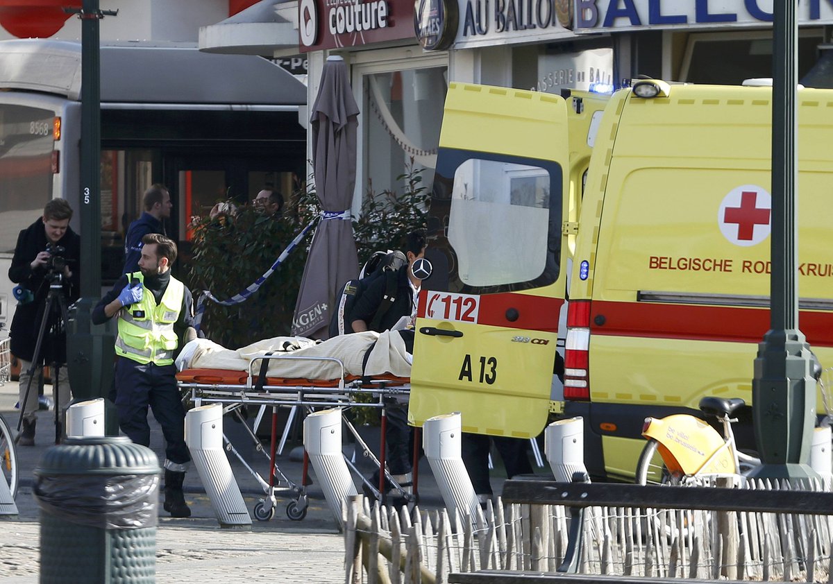 euronews's tweet photo. In pictures: Victim removed from the scene where shots were fired in the suburb of Forest near #Brussels #Belgium https://t.co/nhXbGva2id