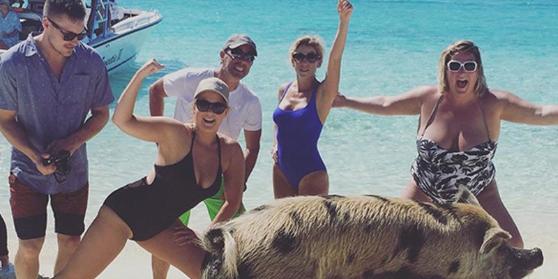 people's tweet photo. Amy Schumer posted a vacation photo with boyfriend Ben Hanisch—and a giant pig 😳 https://t.co/cPo5XDl2LT https://t.co/APm91FCxfH