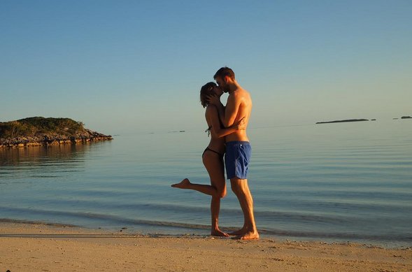billboard's tweet photo. Taylor Swift &amp; Calvin Harris share intimate beach vacation photos🌴  https://t.co/5LVLFjbKPN https://t.co/xM84SL7HRt
