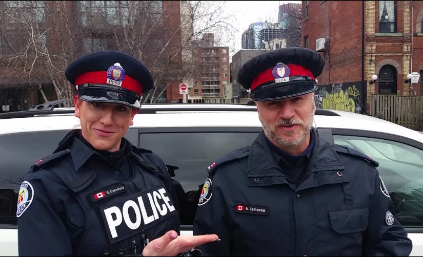 TorontoPolice's tweet image. Kind officers from @TPS52Div were seen taking time to check on a young man &amp;amp; his dogs bit.ly/1UgeA3Z ^rb