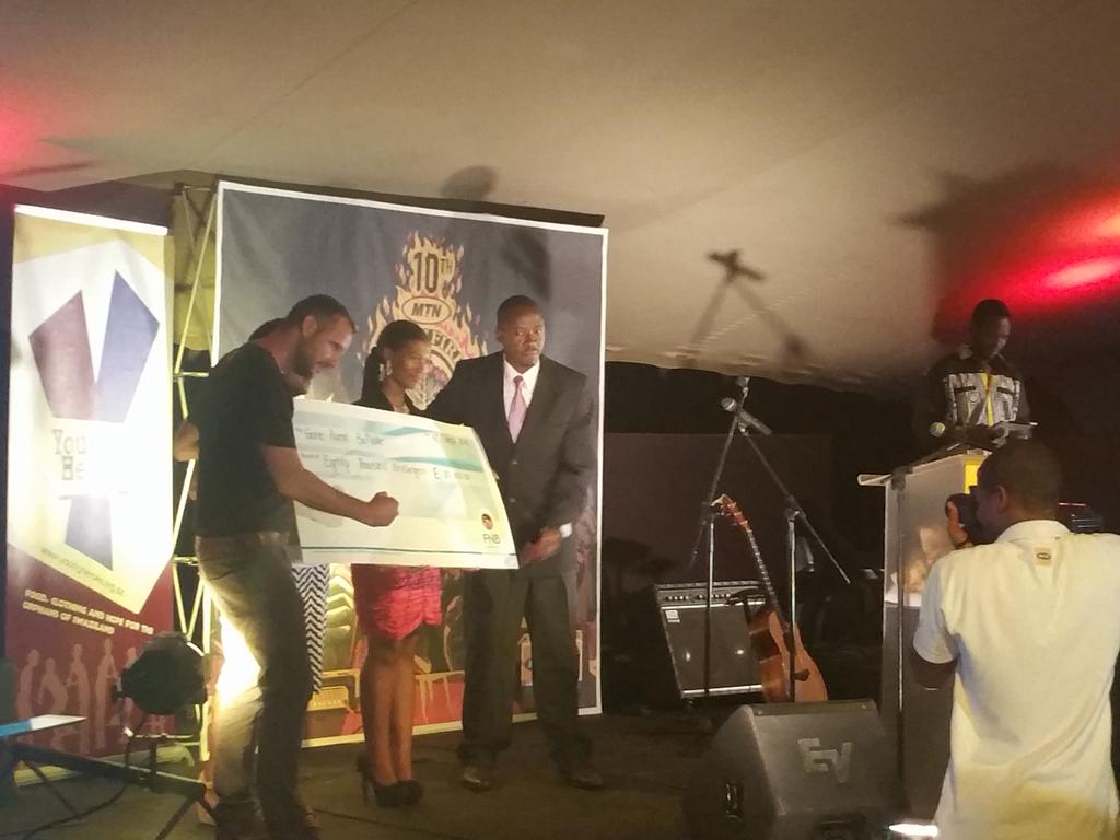MTNBushfire's tweet photo. Sholto Thorne ,the Festival Director, presenting a cheque worth E80 000 to @GoneRuralBomake #BringYourFire #WeAre10 https://t.co/sjXBqko0aY