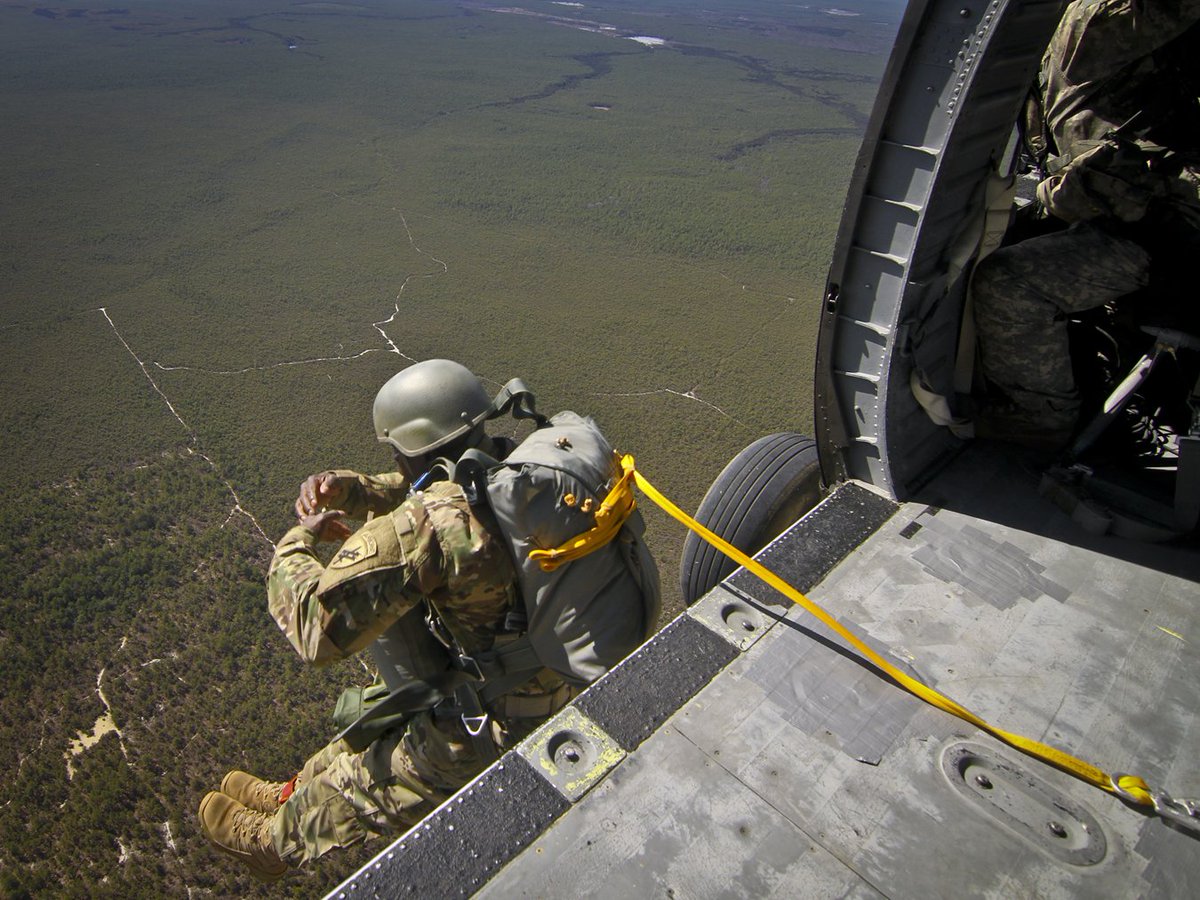 USArmy's tweet photo. A @USArmyReserve paratrooper jumps from a UH-60 Black Hawk at @jointbasemdl, N.J., March 12, 2016 https://t.co/kxo6OPqntL