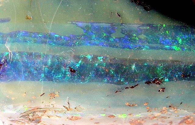 crystalgasm's tweet photo. opals are so fascinating because they look like they contain universes inside of them https://t.co/tELBZ2mtze