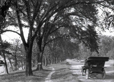 A vehicle rolls down River Road, now paved and known as Front Street, likely just north of Harrisburg in 1912 #TBT