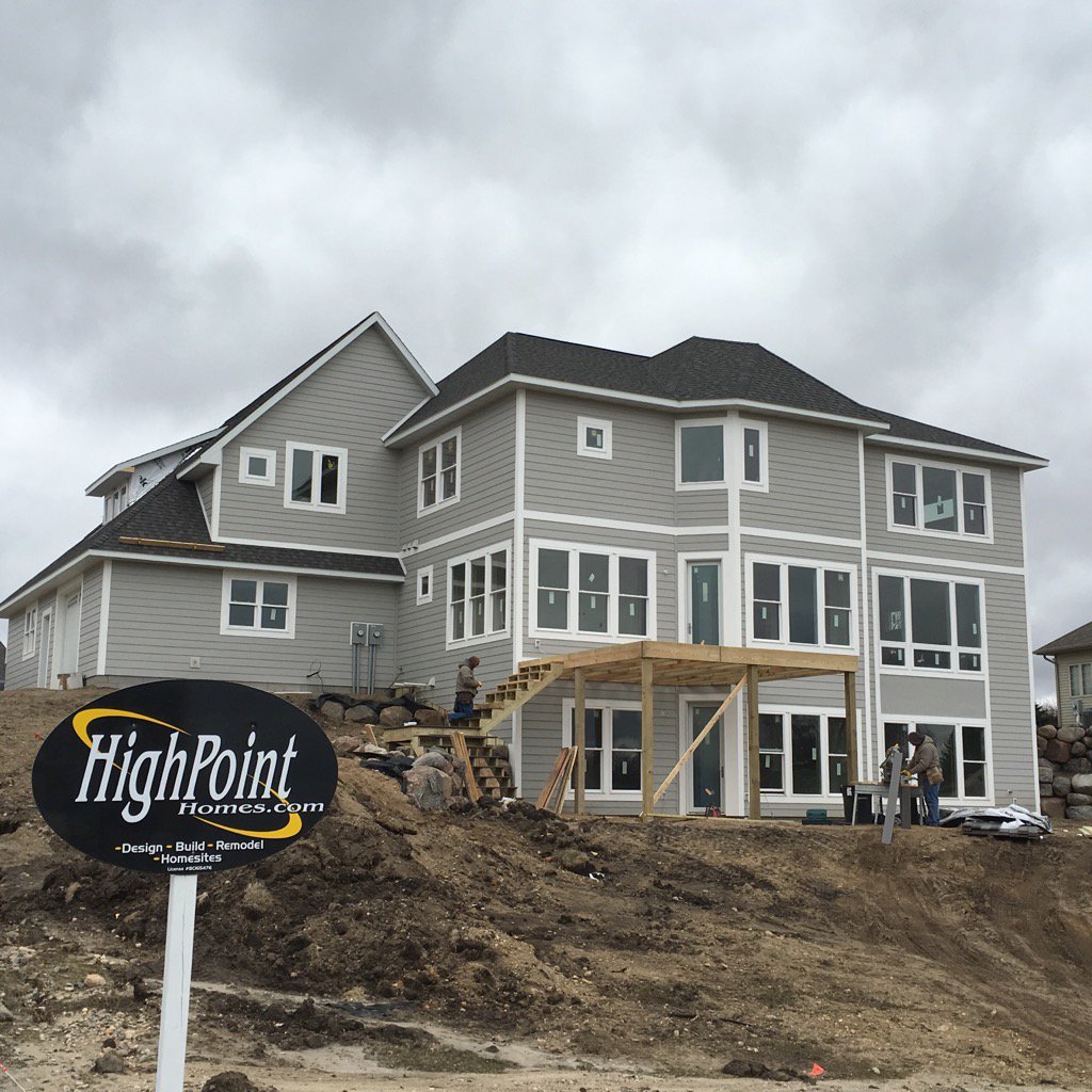 HighPointHMN's tweet image. The winds off Lake Latoka did not stop carpenters from working on deck stairs for this beautiful two-story home.